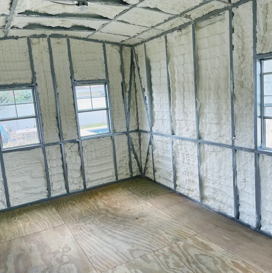 Closed-cell spray foam insulation applied to wall cavities in a residential project in Sumter